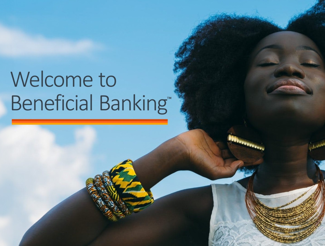 A woman with her eyes closed and smiling, with the text "Welcome to Beneficial Banking"