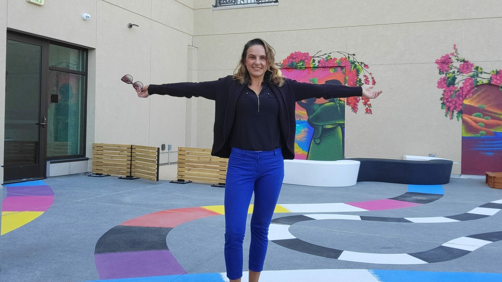 Krystell Guzman, Founder of Plazita School Inc., stands in a play yard.