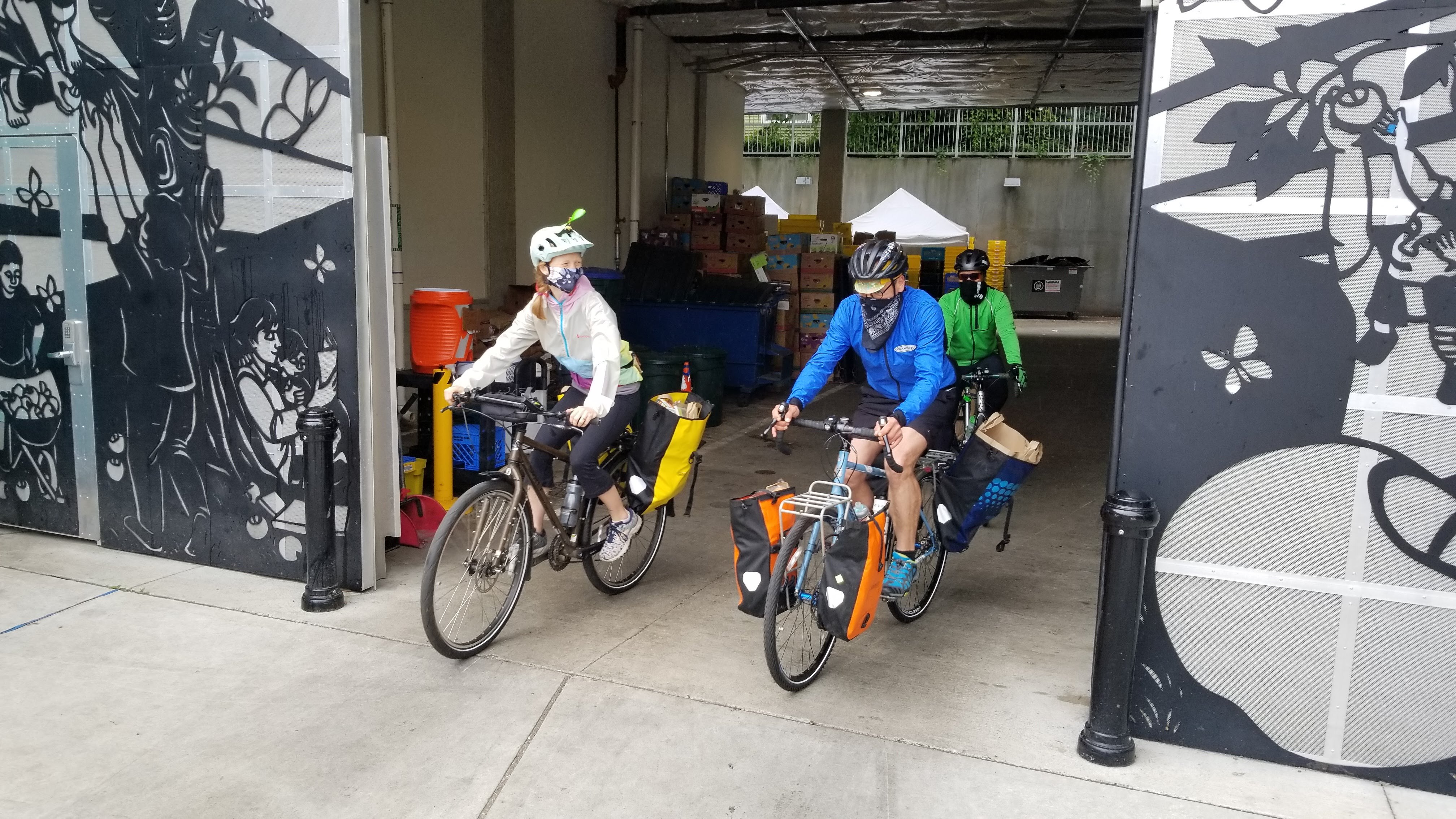 Pedaling Relief Project volunteers on bikes deliver food from the Food Bank to homebound customers. Credit: Seattle Pedaling Relief Project volunteers Pedaling Relief Project volunteers on bikes deliver food from the Food Bank to homebound customers. Credit: Seattle Pedaling Relief Project volunteers