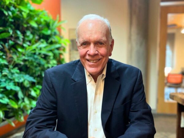 Dale Walker sitting at a table smiling