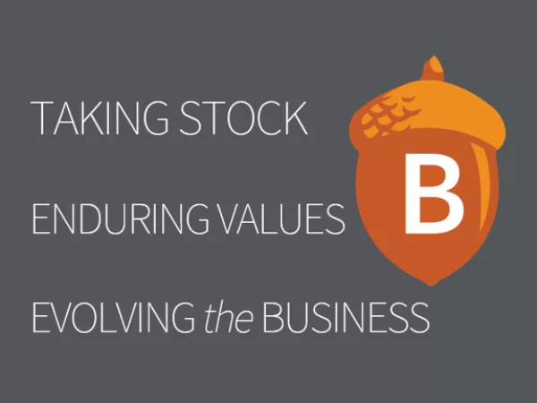 An acorn with the text "Taking stock, enduring values, evolving the business."