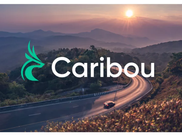 Image of a car driving down the road with Caribou's logo over the top