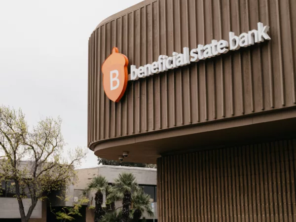 A photo of the outside of Beneficial State Bank's Fresno branch, with the Beneficial State Bank logo displayed on the building.