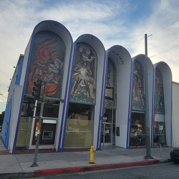 The exterior of the Beneficial State Bank branch in East Los Angeles, with large murals