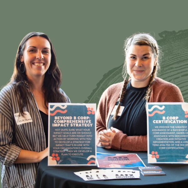 The Co-Founders of The Impact Collective, a Beneficial State Bank client, stand at an event booth