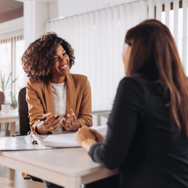 Loan Officer helping woman apply for Loan