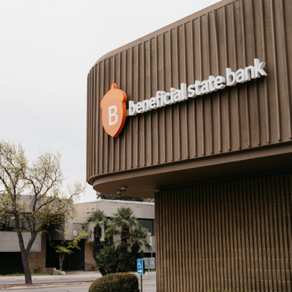 A photo of the outside of Beneficial State Bank's Fresno branch, with the Beneficial State Bank logo displayed on the building.