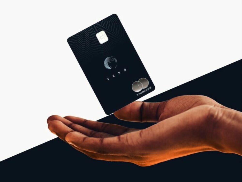 A hand holding the Aspiration Zero credit card